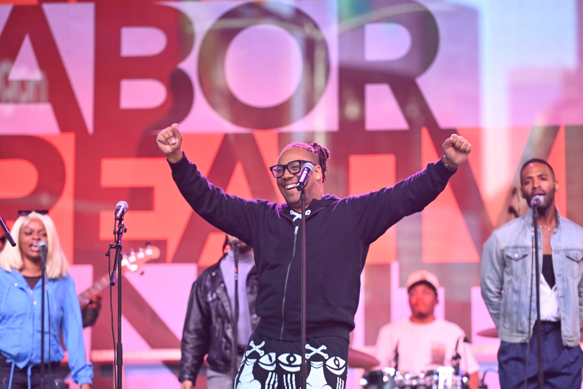 A man performing in front of a microphone. 